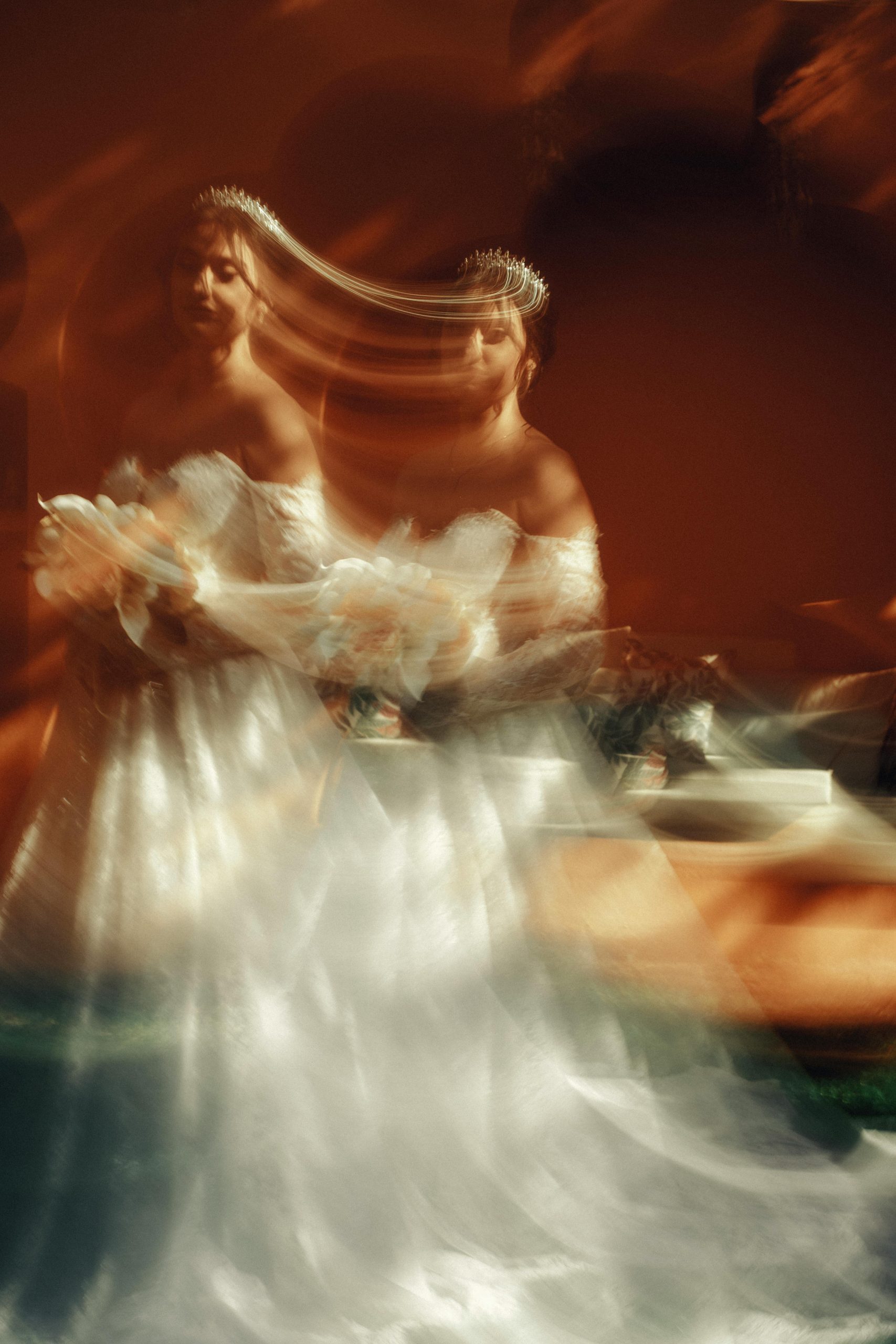 An ethereal bride with a bouquet, captured in artistic motion blur.